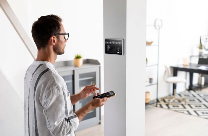 person using smartphone to access his home security system